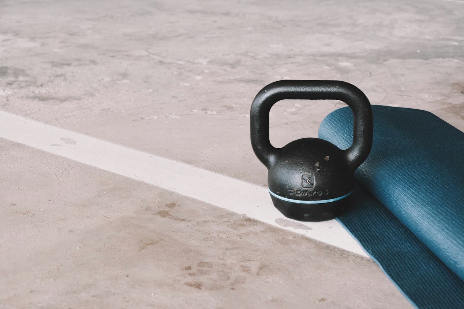 A single kettlebell on a gym floor