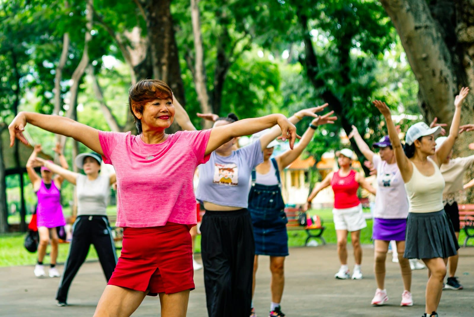 Older adults exercising together outdoors