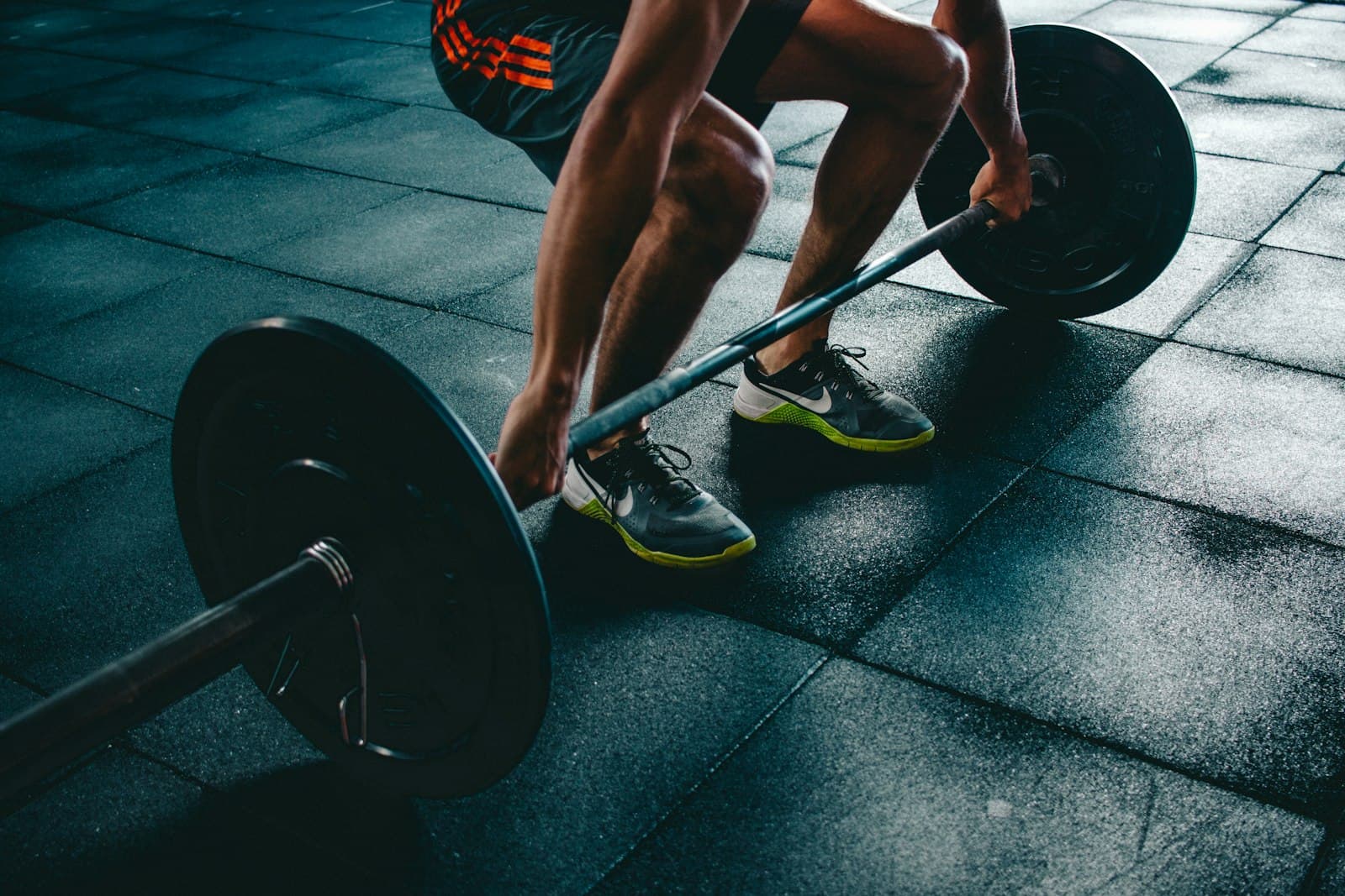 A lifter setting up under a loaded barbell