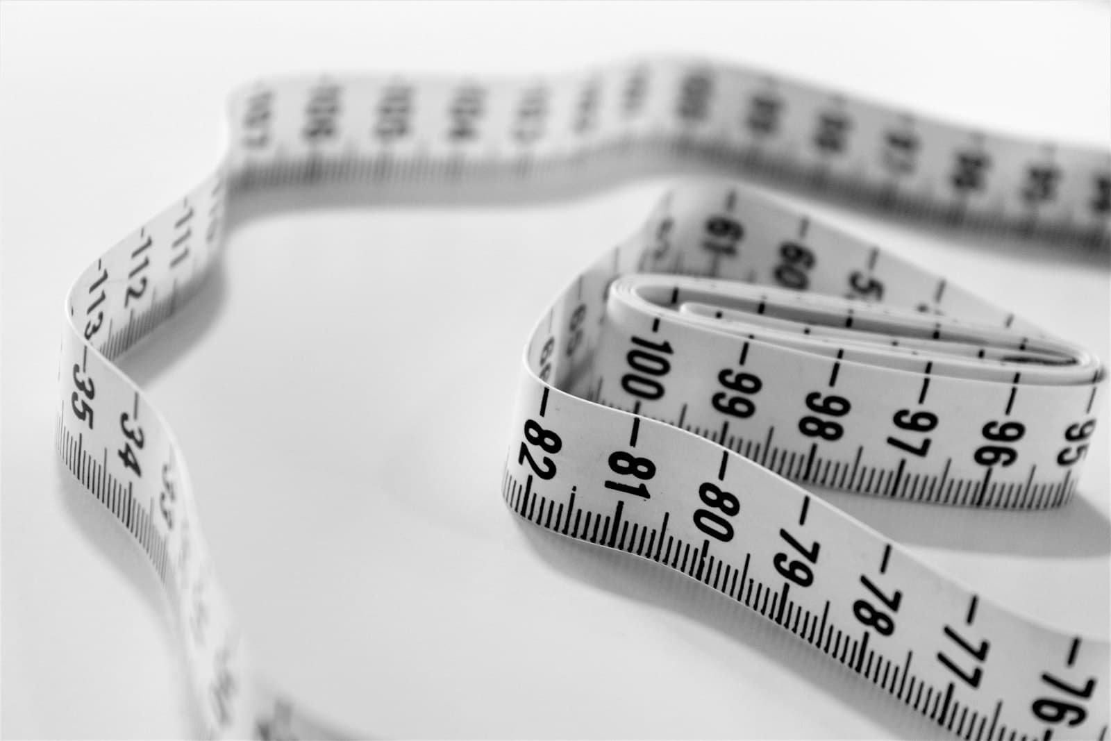 A tape measure coiled on a surface